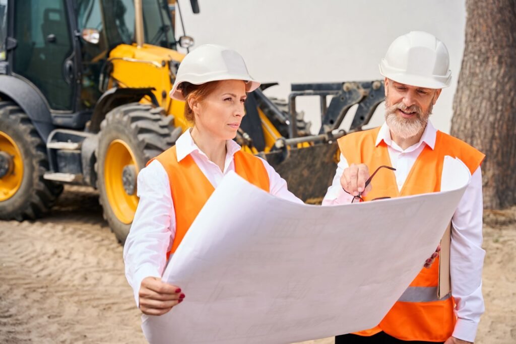 Engineers reviewing site drawings