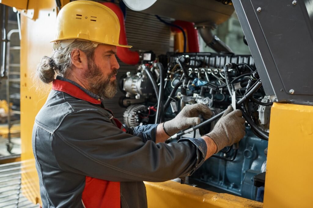 Technician servicing a diesel engine